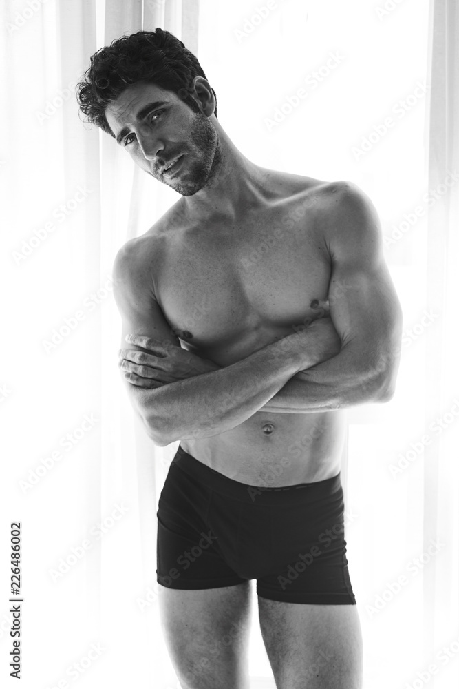 Fototapeta premium Portrait of handsome guy in shorts