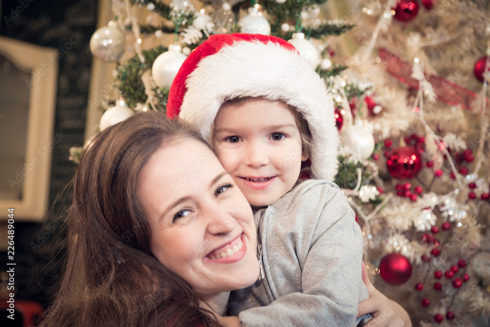 Portrait of embraced mother and son on Christmas. Portrait of embraced mother and son on Christmas.
