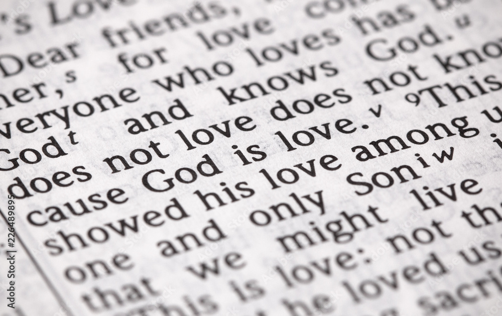 Fototapeta premium Bible Verse God is Love in Narrow Focus