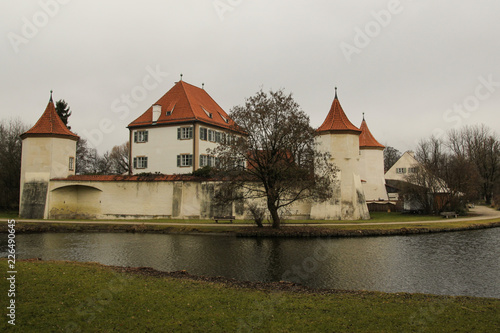 Germany castle with red roof near the lake