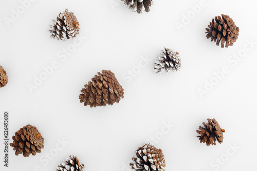 Christmas pattern made of christmas pine cones on white background. Creative flat lay, Creative flat lay, top view design