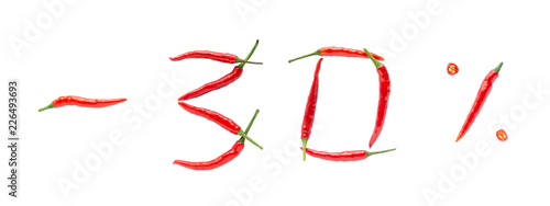 Hot sale or discount concept. Writing made of fresh chilli peppers on white background. Thirty percent discount rate