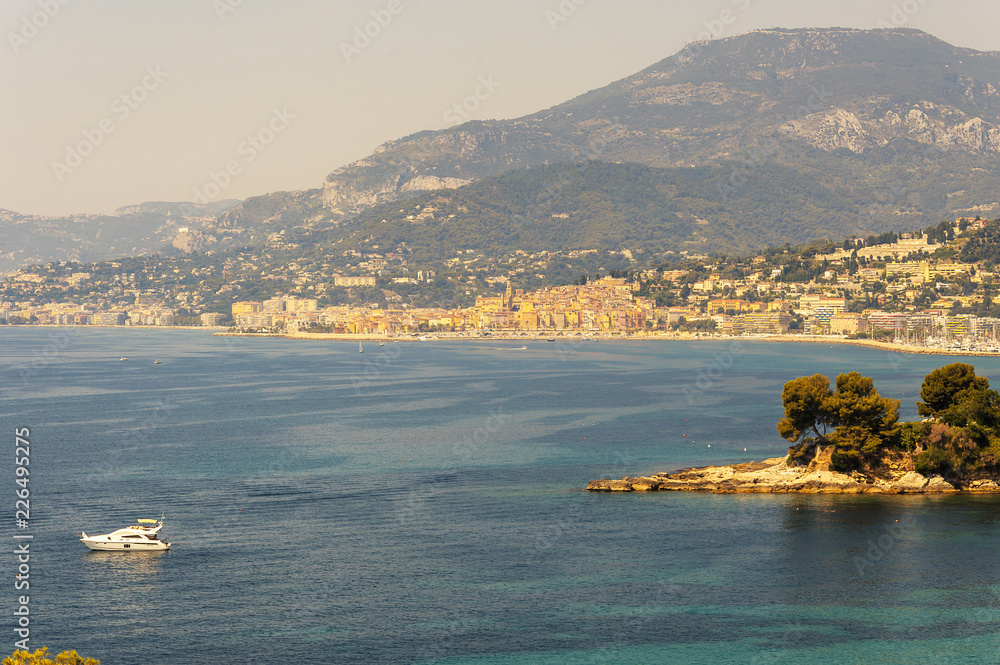 Gulf of Balzi Rossi in Ventimiglia in Italian Riviera with Menton and Cap Martin on the background