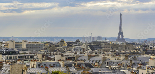 The roofs of Paris and its chimneys under a clouds sky © FreeProd