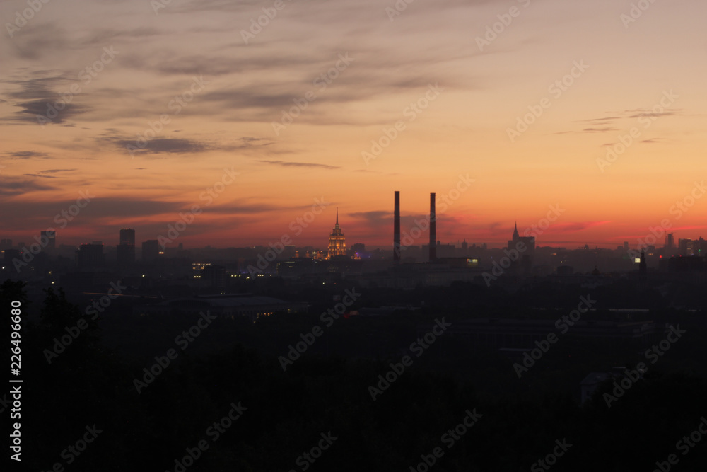 Urban industrial silhouette photo of Moscow at beautiful orange sunset 