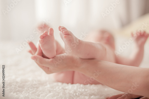 Baby legs in mother s hands