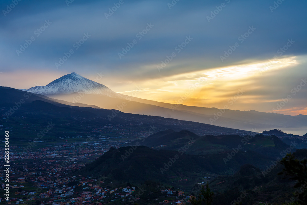 Sunset over Tenerife landscape with volcano Pico del Teide in snow