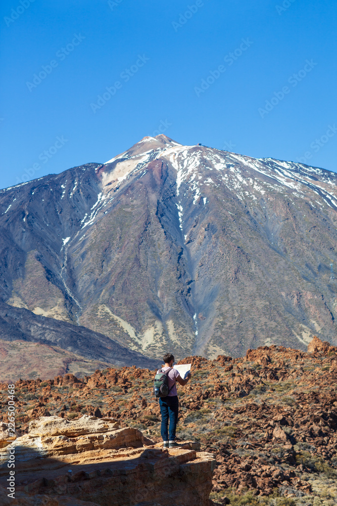 Lost hiker checks map to find directions Lost hiker checks map to find directions