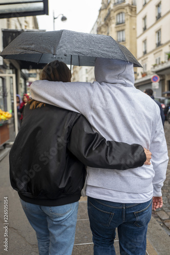 A couple walking in the street in Montmartre, Paris, France