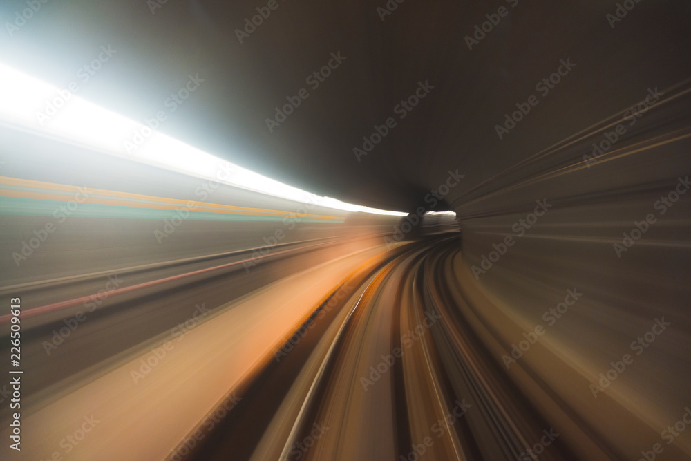 Blurred high speed motion of a train travelling through a tunnel
