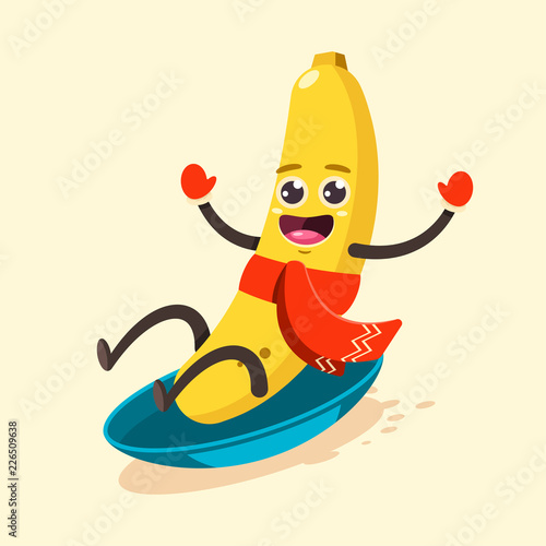 Cute Banana kid in scarf cartoon character sledding on snow. Winter sports and activities. Vector flat funny fruit illustration isolated on background.