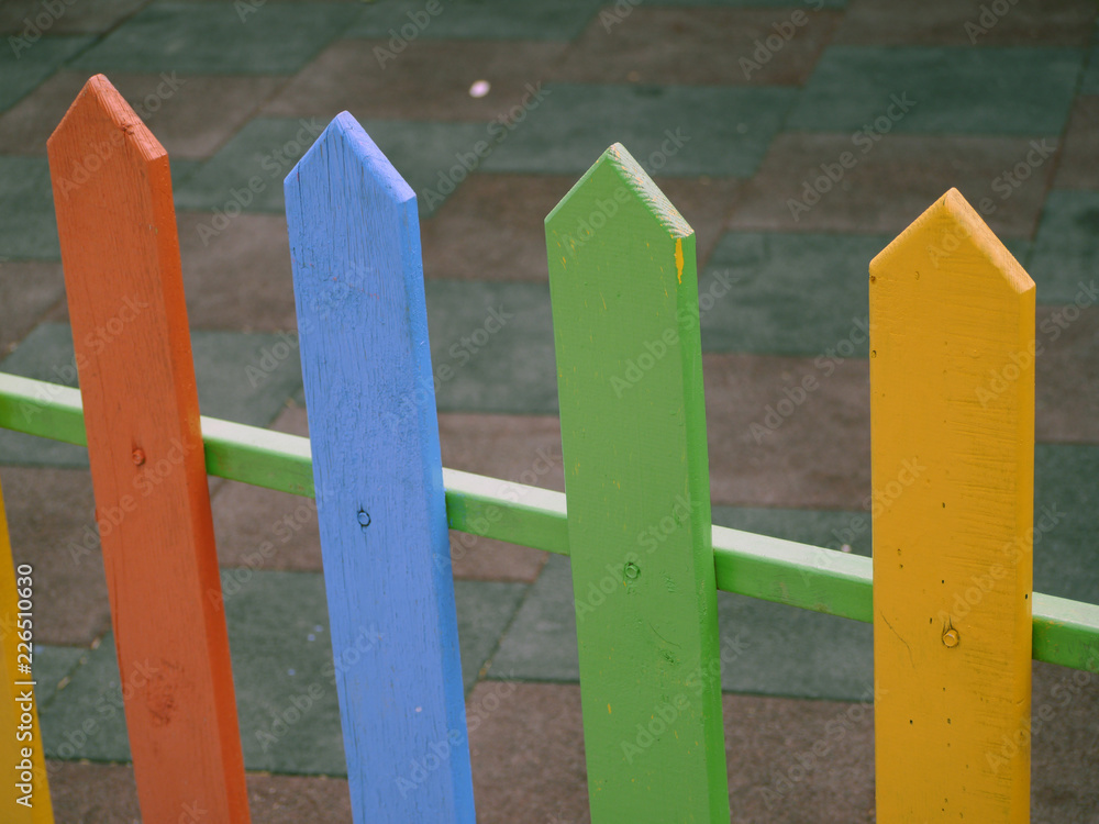 Colored wooden fence railings