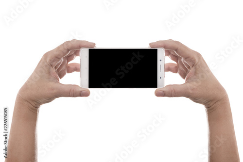 Two hands hold new modern smartphone with blank black screen - internationally known human hand gesture isolated on white background with copy space