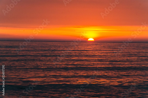 Horizontal sunset over the pacific ocean in Lima, Peru
