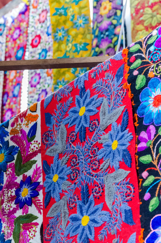 Colorful handmade fabrics on Aguas Calientes, Peru © LautaroFederico