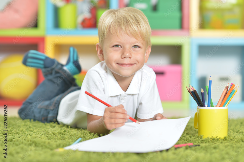 Portrait of a cute little boy drawing with pencils Portrait of a cute little boy drawing with pencils