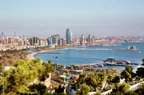 Baku city, view over the roofs .Baku cityscape with famous flagpole on the National Flag Square in Baku, Azerbaijan . Panoramic view to the Boulevard of Baku seaside esplanade eastwards