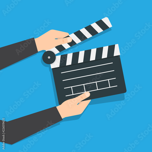 Opened movie clapper board in hands
