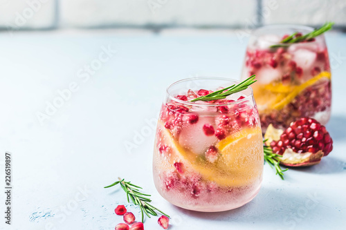 Festive drinks, citrus, pomegranate cocktail. Selective focus, space for text. photo
