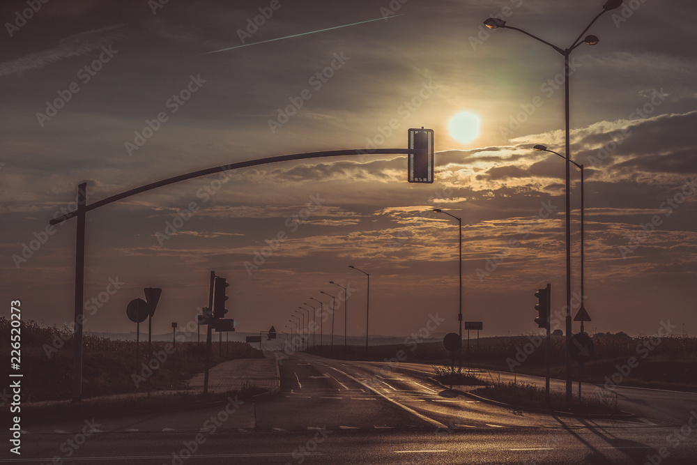 Fotografie View of the crossroads, early in the morning, the sun rises