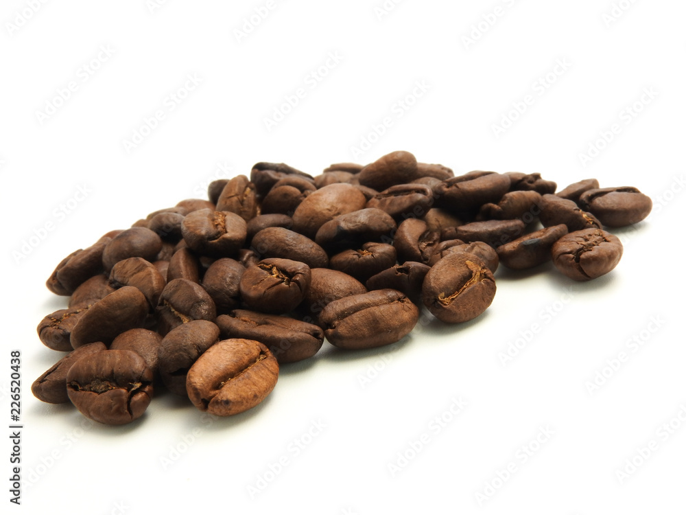 A pile of coffee beans isolated on white background.It can be made into drinks and beverages,like latte,cappuccino, espresso.Economic crop in global trade business,agricultural products exports. A pile of coffee beans isolated on white background.It can be made into drinks and beverages,like latte,cappuccino, espresso.Economic crop in global trade business,agricultural products exports.