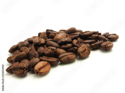 A pile of coffee beans isolated on white background.It  can be made into drinks and beverages like latte cappuccino  espresso.Economic crop in global trade business agricultural products exports.