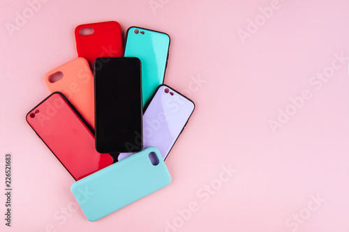 Bild auf Leinwand Set of colored plastic covers for smartphone isolated on a white background
