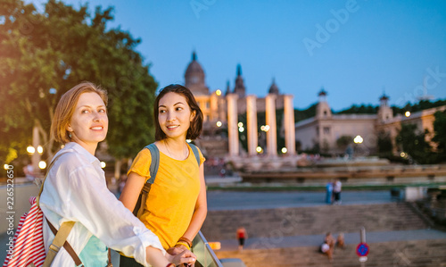 Photography Two Girl friends tourists in National Art Museum of Catalonia at evening time