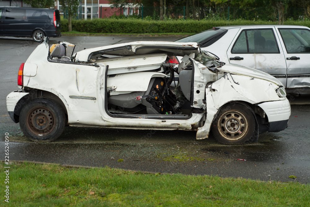 A small white car carved by firemen for training