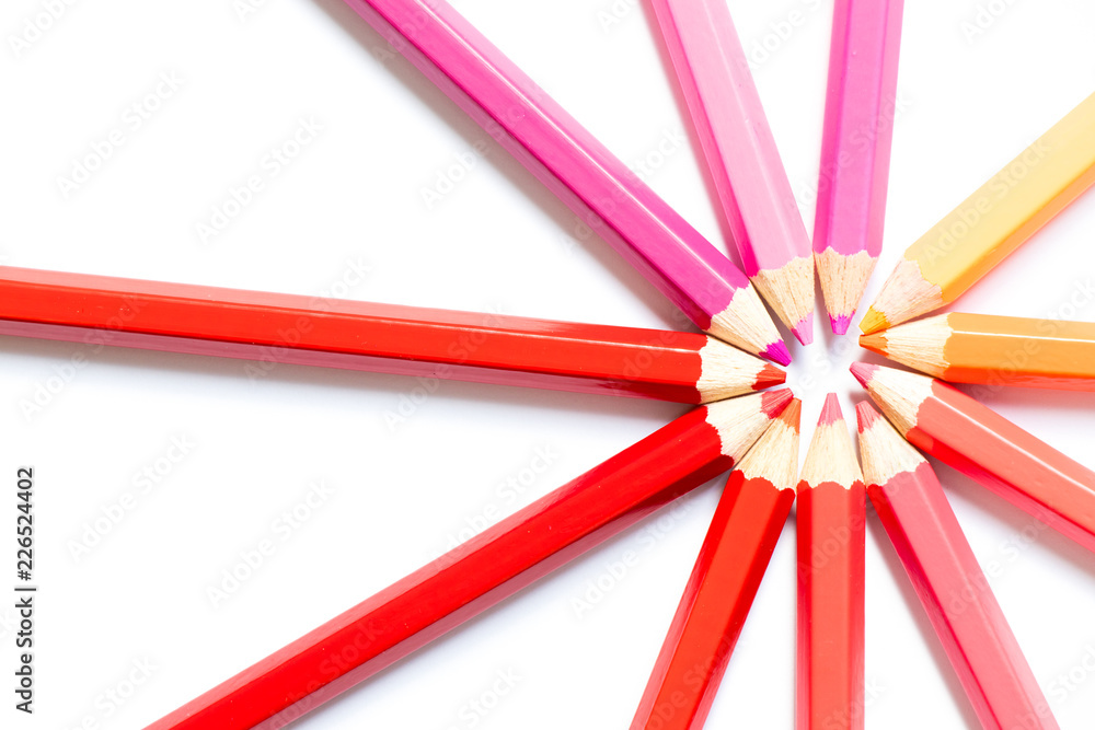 Color pencil arrange in ray shape on white paper background Color pencil arrange in ray shape on white paper background