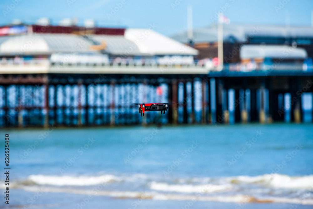 Drone hovering with Cromer Pier in the background