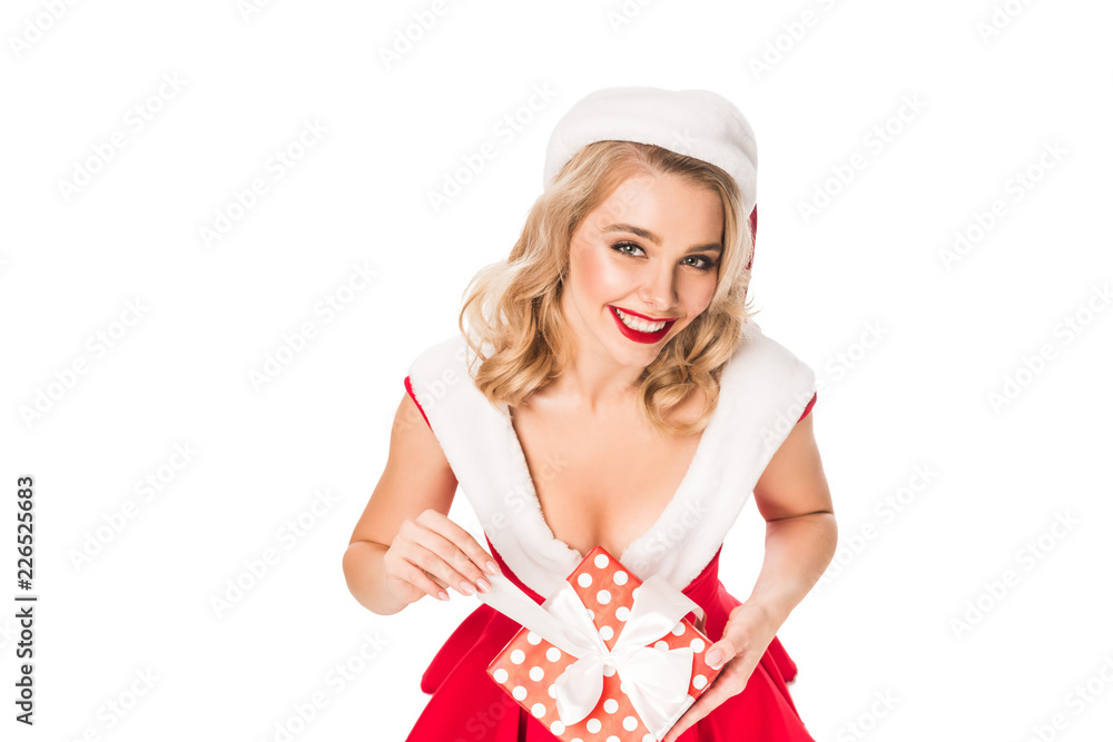 high angle view of sexy santa girl in christmas hat standing with gift box isolated on white high angle view of sexy santa girl in christmas hat standing with gift box isolated on white