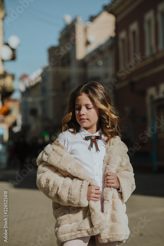 Walk around the city. A warm day. A cute child.