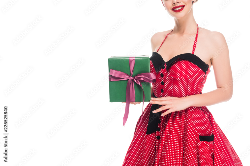 partial view of woman in retro pin up dress showing gift box isolated on white partial view of woman in retro pin up dress showing gift box isolated on white