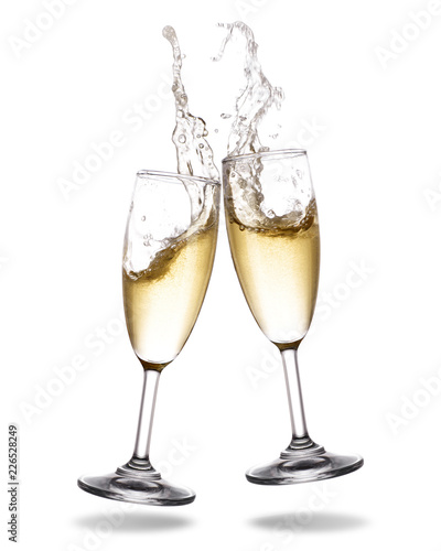 Cheers champagne with splashing out of glass isolated on white background.