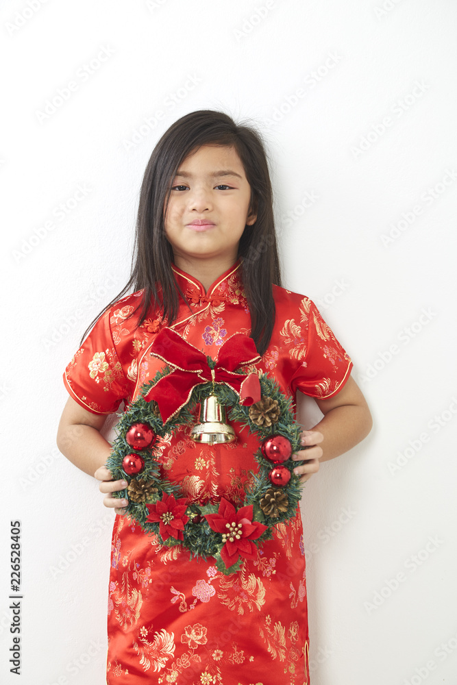 Asian girl with Christmas wreath Asian girl with Christmas wreath