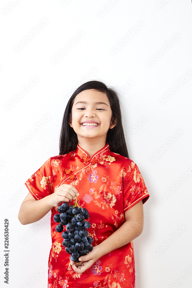 girl with holding a Eating Grape bunch girl with holding a Eating Grape bunch