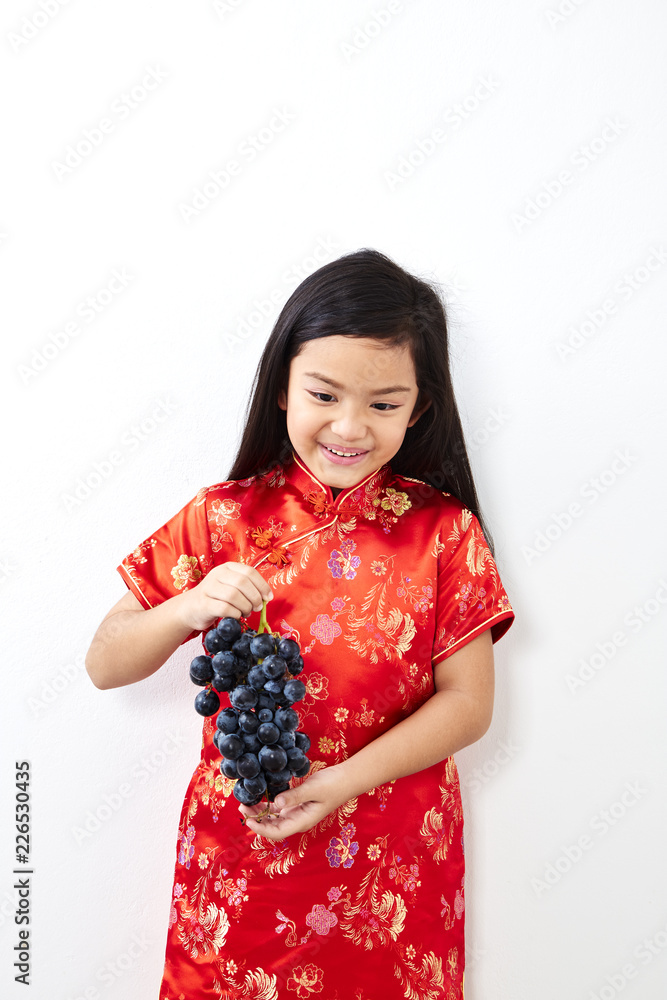 girl with holding a Eating Grape bunch girl with holding a Eating Grape bunch