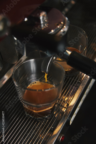 close-up of coffee machine preparing espresso in two cups © LIGHTFIELD STUDIOS