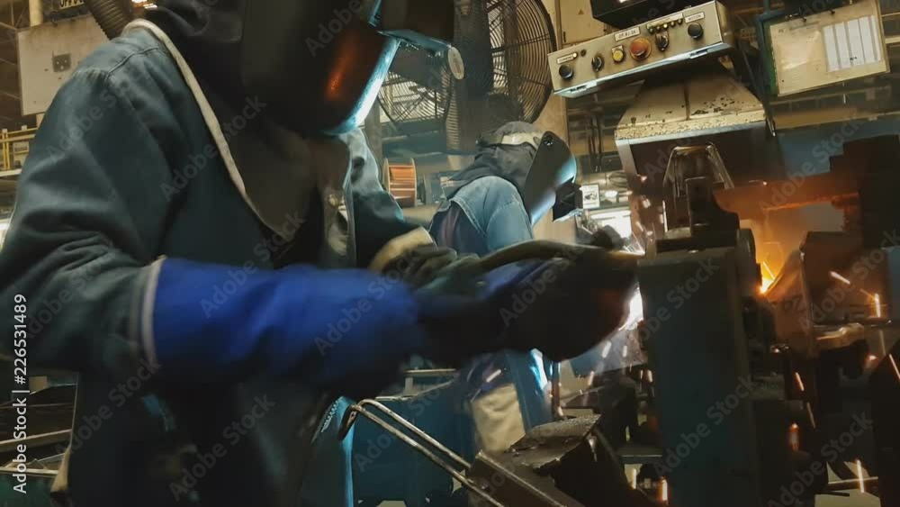 MIG Co2 gas welding by skill welder in car factory Industrial MIG Co2 gas welding by skill welder in car factory Industrial