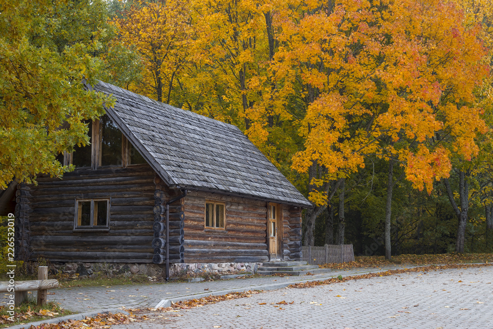 Old wooden barn in the medieval village. Historical landmark of Latvia. Old wooden barn in the medieval village. Historical landmark of Latvia.