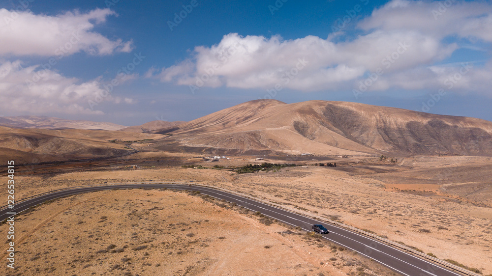 aerial view of road and volcanic mountain