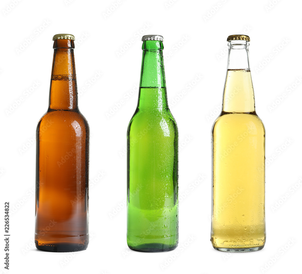 Set with different cold beer bottles on white background Set with different cold beer bottles on white background
