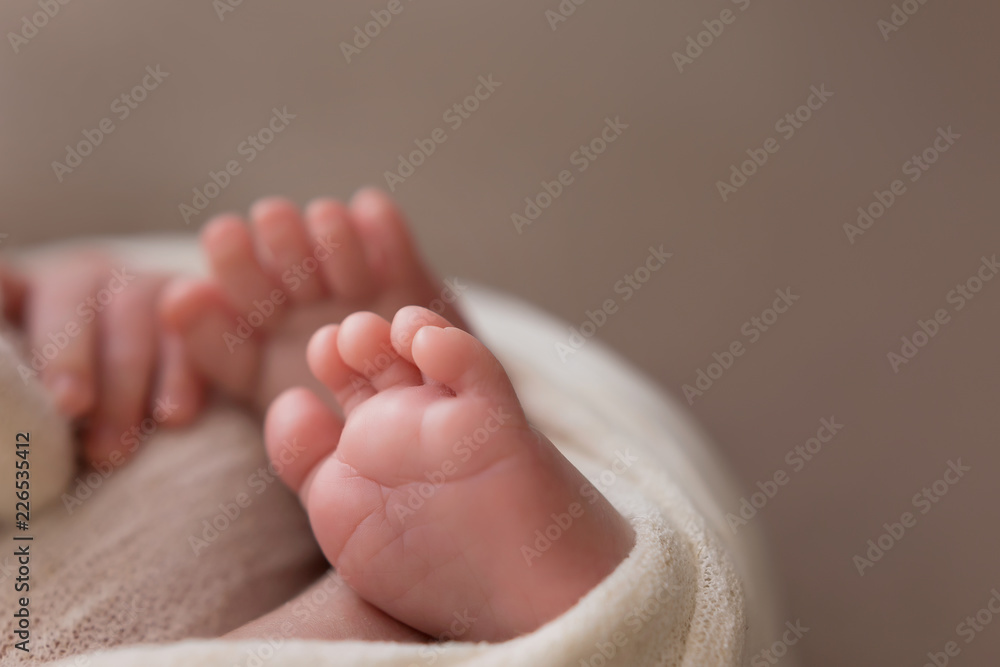 the legs of the newborn baby. the legs of the newborn flaky skin. peel off the skin. peeling skin newborn. newborn child. feet