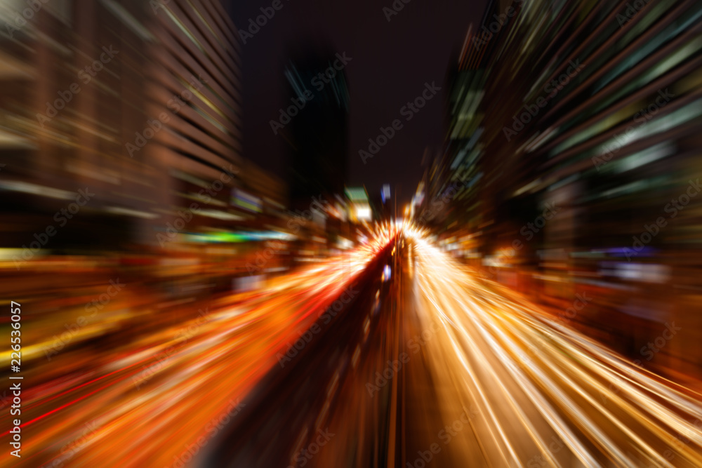 Abstract blurred traffic in the city at night with motion zoom blur in bangkok, Thailand