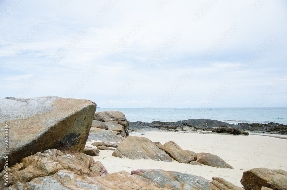 great stone on beach with sea background