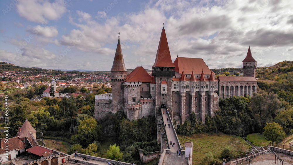 Fototapeta premium Aerial view of medieval Corvin Castle or Corvinilor or Hunyad Castle in Hunedoara, town in beautiful Transylvania, Romania.