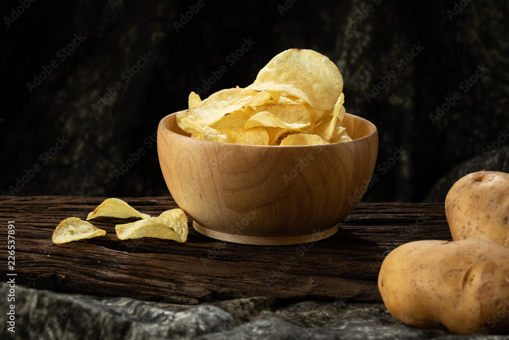 potato chip crispy in wood bowl on wood background unhealthy cause of