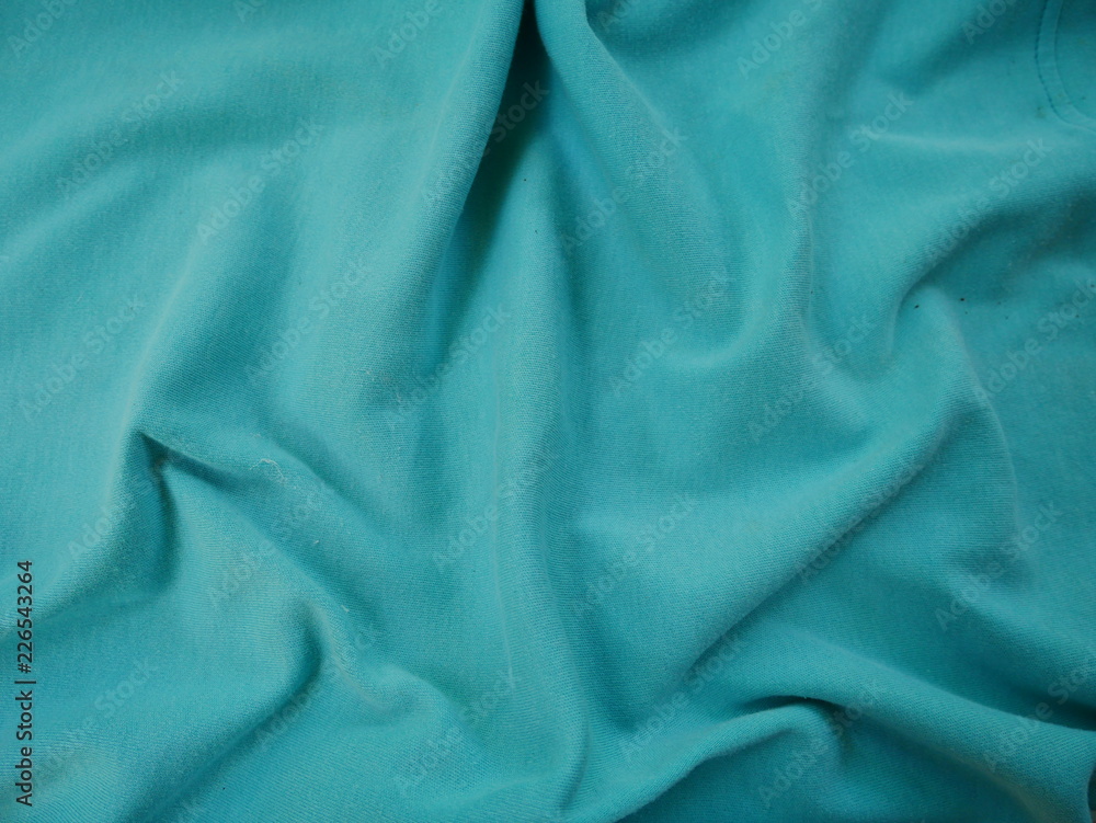green texture of silk fabric background green texture of silk fabric background