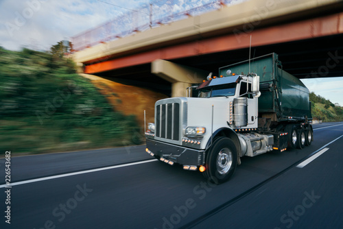 Canvas Print Garbage trash truck on highway motion blur concept